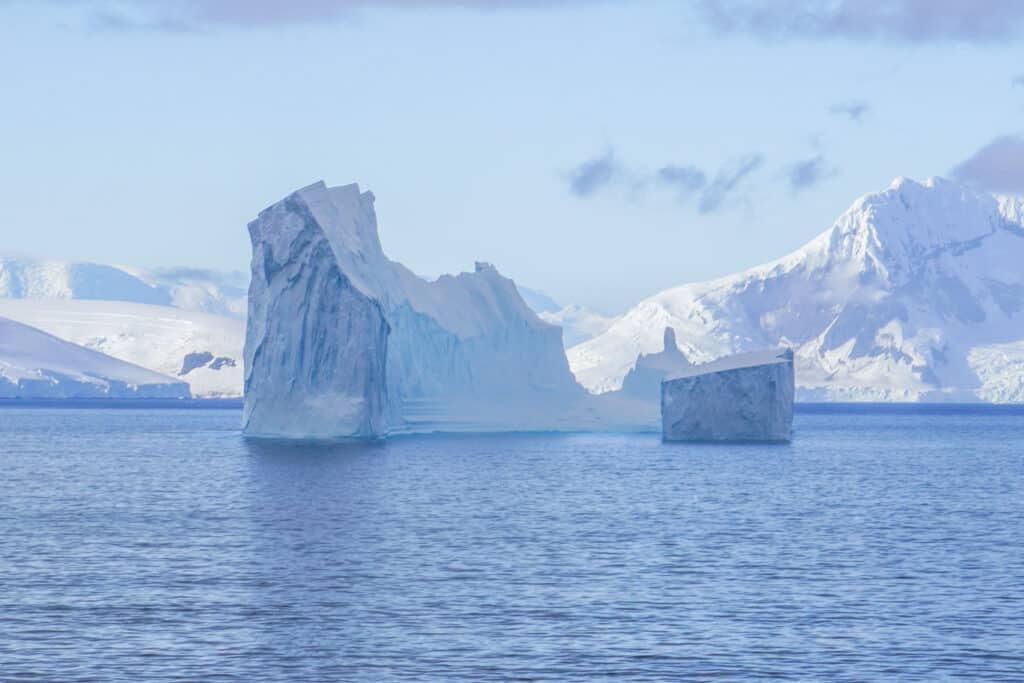 Icebergs in Antarctica, which do not have polar bears because they don't live in Antarctica.