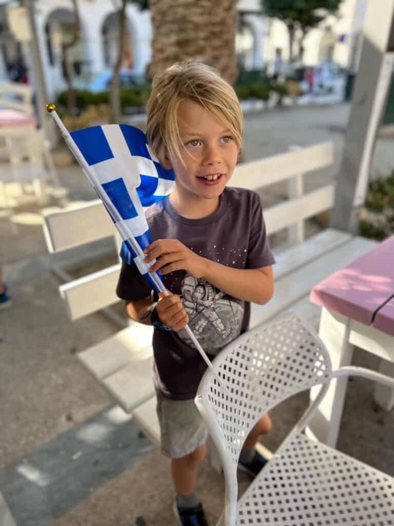 Jagger holding the Greek flag in Syros, Greece