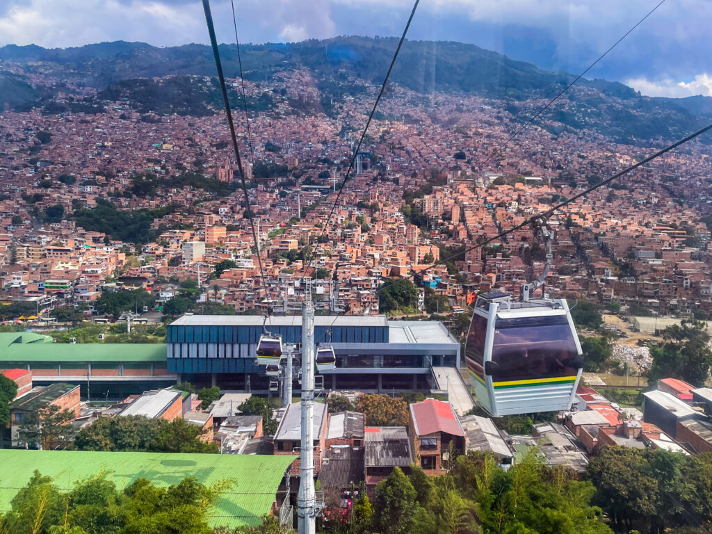 Cable car ride in Medellin takes you up the hill with panoramic views of the city. 