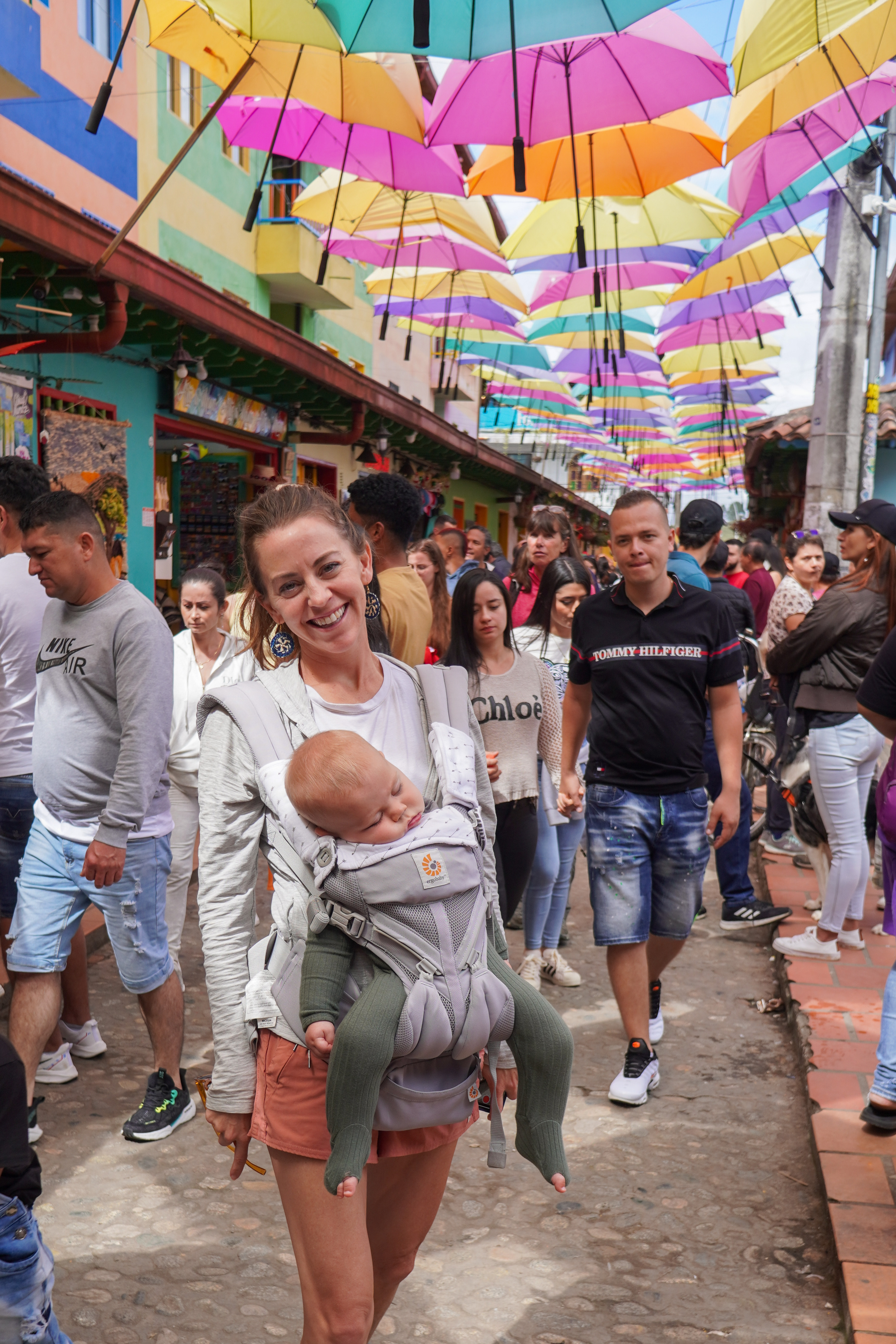 Stroll down the umbrella street in Guatape after visiting El Penol Rock during your Colombia 3 week itinerary.