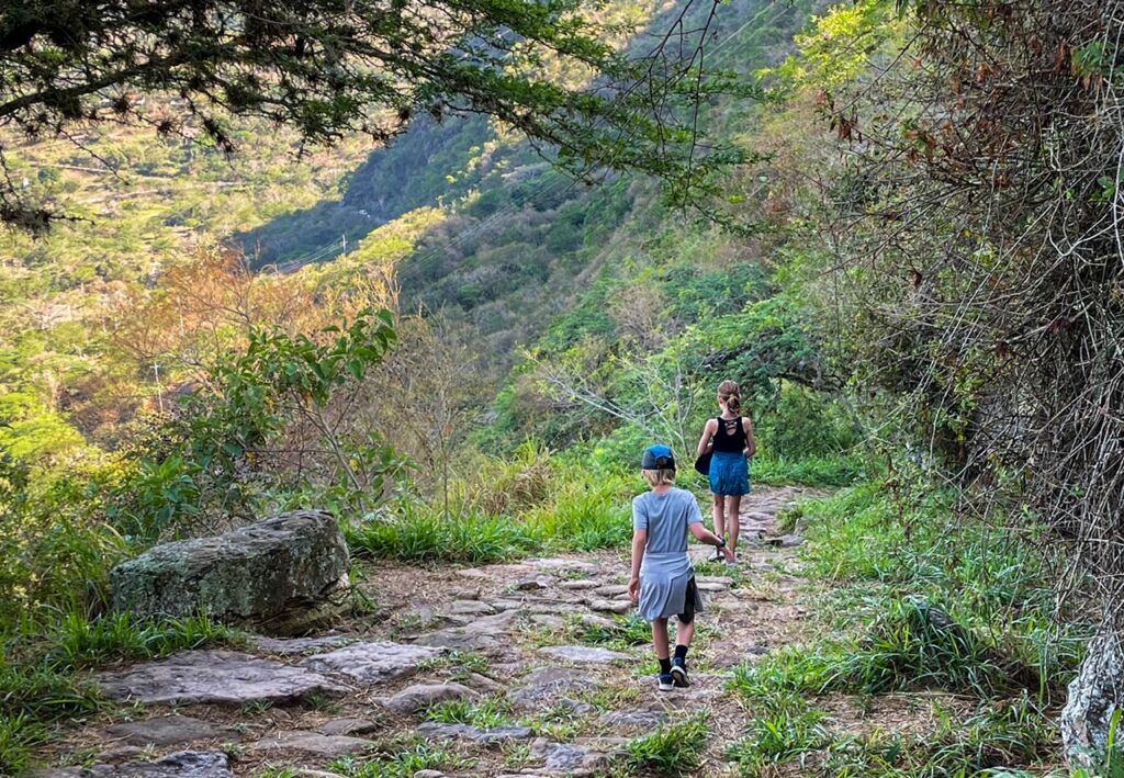 Kids walking along the ancient Camino Real from Barichara to Guane, a unique thing to do in Colombia. 