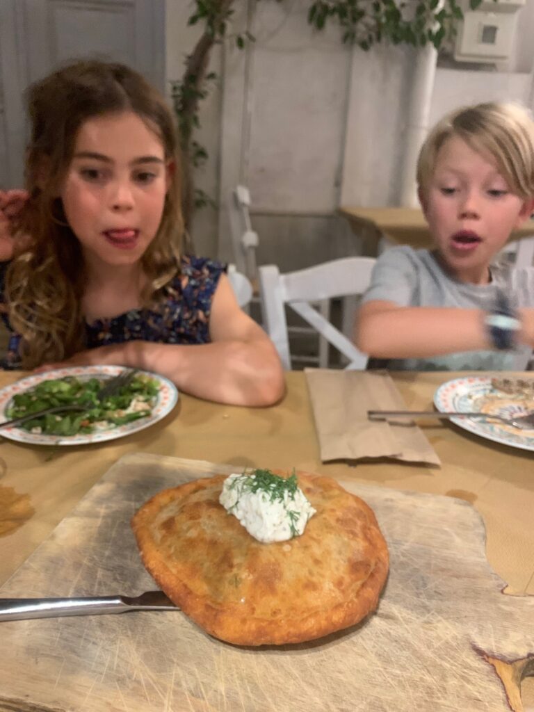 The homemade Leek Pie is a local Syros specialty, which these kids were excited to dig into at Arhontariki Restaurant in Ermoupolis. 