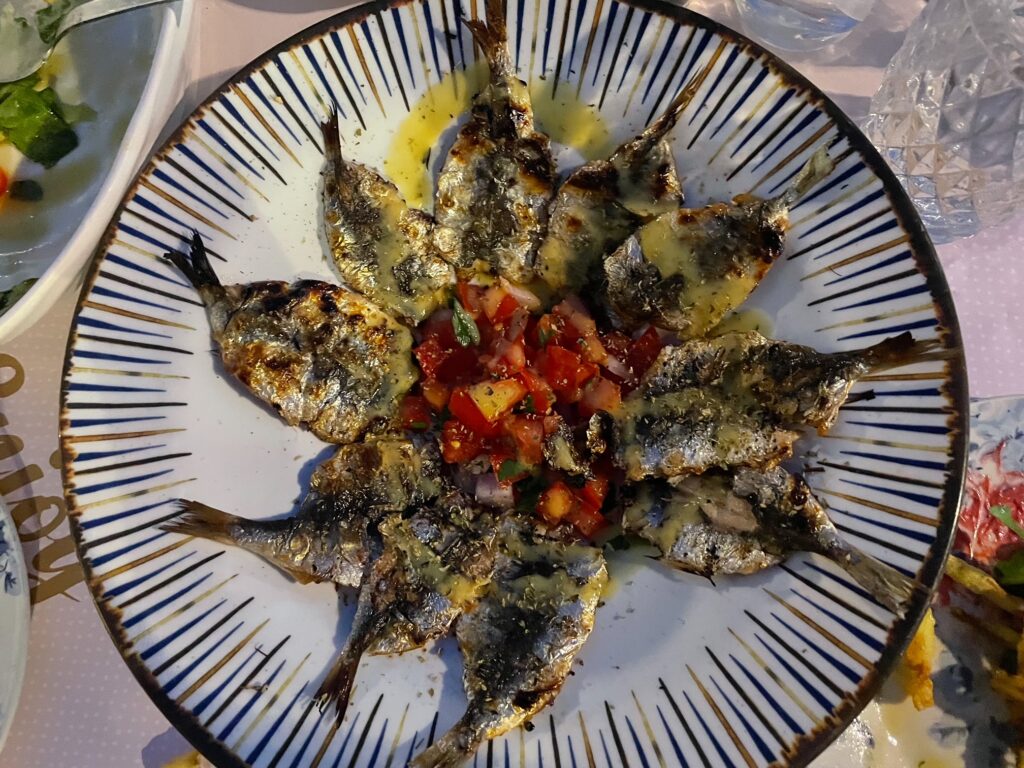 A delicious plate of fresh grilled sardines at a fish restaurant in Syros.