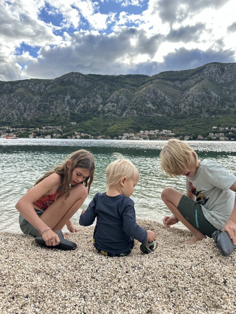 The beach in Kotor Montenegro is rocky, but still nice to have easy access to the water with majestic mountains surrounding us!