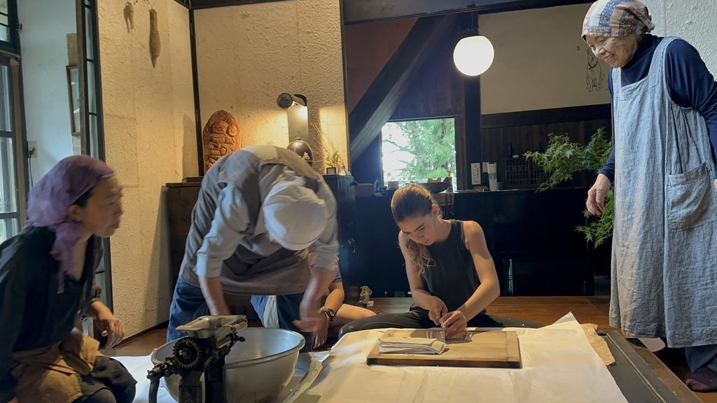 Local village grandmothers in rural Japan cooking with our kids at Kuu House, a unique stay in Japan for families.