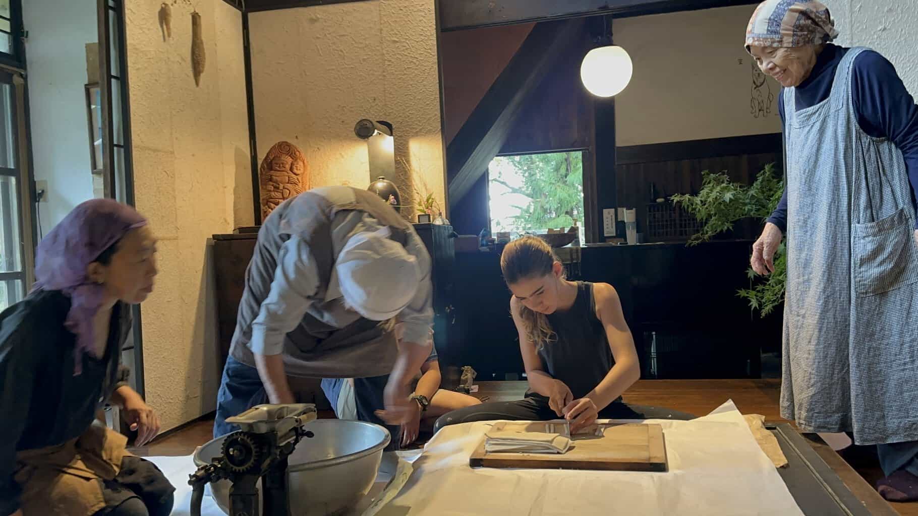 Local village grandmothers in rural Japan cooking with our kids at Kuu House, a unique stay in Japan for families.