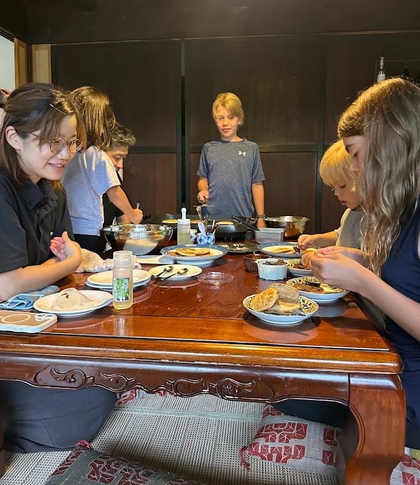 our kids making traditional Japanese sweets with the local family at Magokoro Inn in Japan